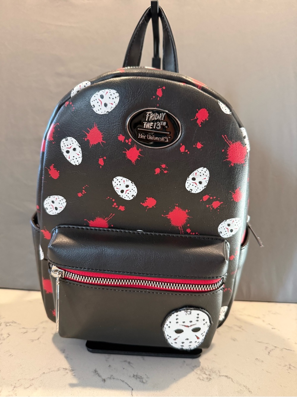 Her Universe Black Mini Backpack with Red and White Mask Print